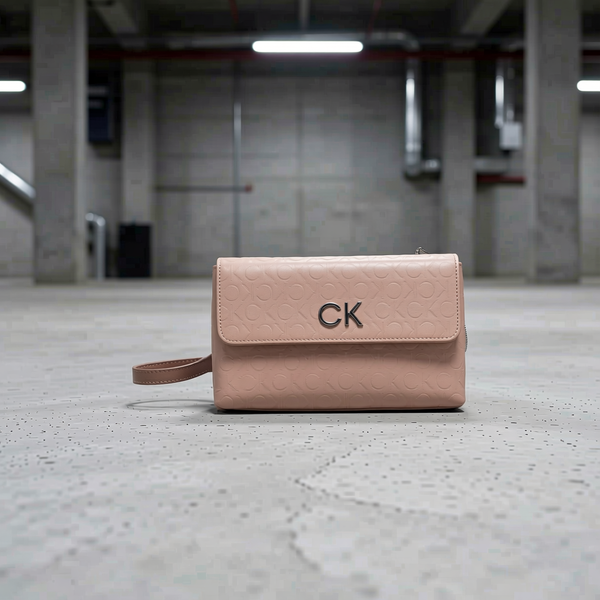 Calvin Klein - Minimalist Embossed Logo Crossbody Bag - Pink Calvin Klein